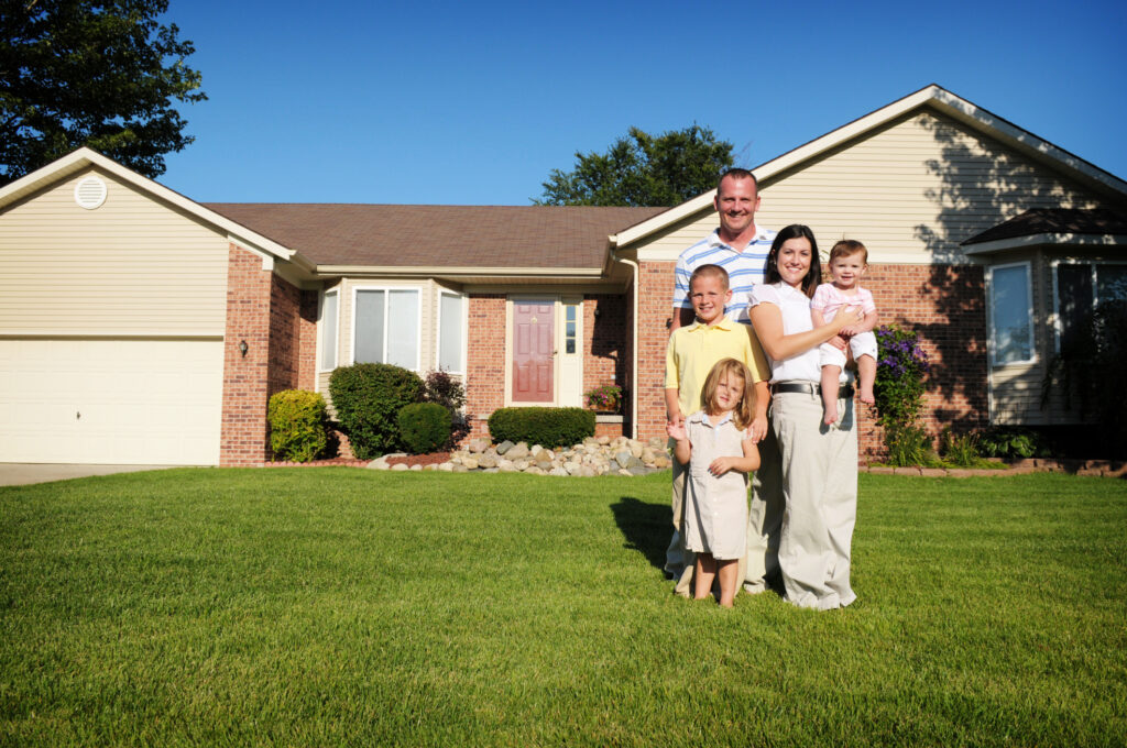 Family in front of house